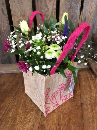 Pink Delight - Shades of pink flowers lovingly arranged in foam and presented in a hessian bag

 

Each and every display is one-of-a-kind, created by an artisan florist using the most beautiful and fresh stems available on the day so, whilst your gift may look different to the one pictured, we do guarantee that your specific arrangement will be fresh, beautiful and that your recipient will love it!