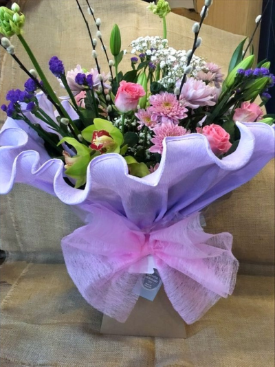 Fanfare - All the fuss you could wish with these beautifully arranged flowers , greens, pinks and lilac are the theame, handtied wrapped in crepe and presented in a box

 

Each and every display is one-of-a-kind, created by an artisan florist using the most beautiful and fresh stems available on the day so, whilst your gift may look different to the one pictured, we do guarantee that your specific arrangement will be fresh, beautiful and that your recipient will love it!