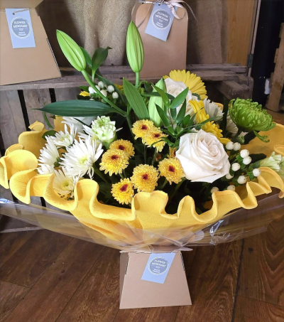 Sunny Days - An exclusive hand picked selection of flowers in yellows, creams and greens, handtied, wrapped in hand crimped crepe and presented in a box.

 

Each and every display is one-of-a-kind, created by an artisan florist using the most beautiful and fresh stems available on the day so, whilst your gift may look different to the one pictured, we do guarantee that your specific arrangement will be fresh, beautiful and that your recipient will love it!