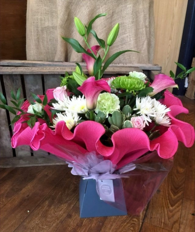 Pink Frill - An exclusive hand picked selection of flowers in pinks and greens, handtied, wrapped in hand crimped crepe and presented in a box.

 

Each and every display is one-of-a-kind, created by an artisan florist using the most beautiful and fresh stems available on the day so, whilst your gift may look different to the one pictured, we do guarantee that your specific arrangement will be fresh, beautiful and that your recipient will love it!