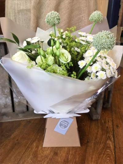 Gracious - Carefully picked white, cream and green flowers and foliage, handtied, wrapped in tissue and presented in a box.

 

Each and every display is one-of-a-kind, created by an artisan florist using the most beautiful and fresh stems available on the day so, whilst your gift may look different to the one pictured, we do guarantee that your specific arrangement will be fresh, beautiful and that your recipient will love it!