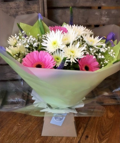 Happy - Beautiful pink Gerbera with carefully picked flowers to compliment, handtied, wrapped in tissue and presented in a box.

 

Each and every display is one-of-a-kind, created by an artisan florist using the most beautiful and fresh stems available on the day so, whilst your gift may look different to the one pictured, we do guarantee that your specific arrangement will be fresh, beautiful and that your recipient will love it!