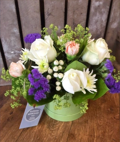 Joyful - A beautiful selection of purple and cream flowers arranged in foam and presented in a hat box.

 

Each and every display is one-of-a-kind, created by an artisan florist using the most beautiful and fresh stems available on the day so, whilst your gift may look different to the one pictured, we do guarantee that your specific arrangement will be fresh, beautiful and that your recipient will love it!