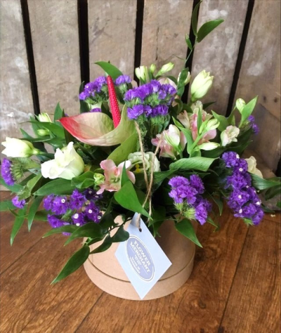 Home Sweet Home - A vibrant mix of flowers arranged in foam and presented in a hat box.

 

Each and every display is one-of-a-kind, created by an artisan florist using the most beautiful and fresh stems available on the day so, whilst your gift may look different to the one pictured, we do guarantee that your specific arrangement will be fresh, beautiful and that your recipient will love it!