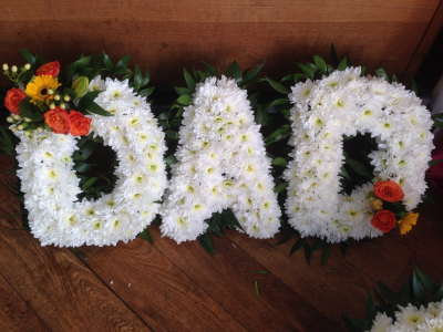Massed Letters - Dad - Letters based in white chrysanths with flower sprays in a colour of your choice