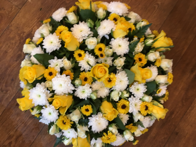 Posy Arrangement - Round posy arrangement is a heartfelt floral tribute filled with warmth and joy. It features a vibrant mix of yellows and whites